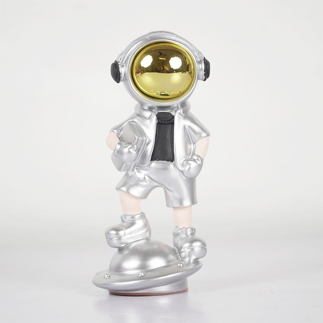SpaceVibe™ Silver Astronaut Figurine – Metallic Resin Showpiece