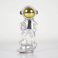 SpaceVibe™ Silver Astronaut Figurine – Metallic Resin Showpiece