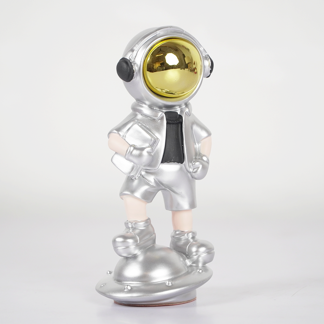 SpaceVibe™ Silver Astronaut Figurine – Metallic Resin Showpiece