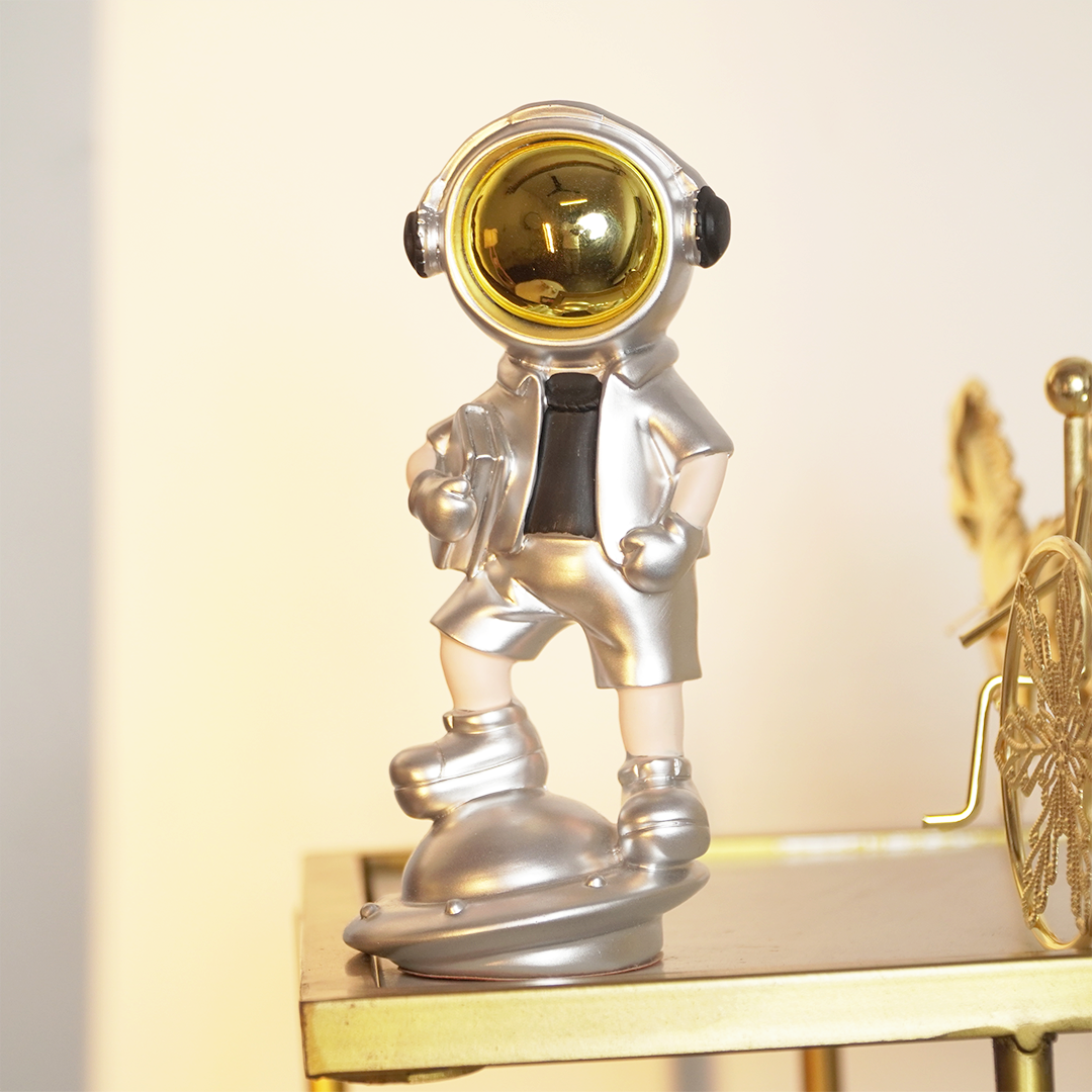 SpaceVibe™ Silver Astronaut Figurine – Metallic Resin Showpiece