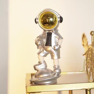 SpaceVibe™ Silver Astronaut Figurine – Metallic Resin Showpiece