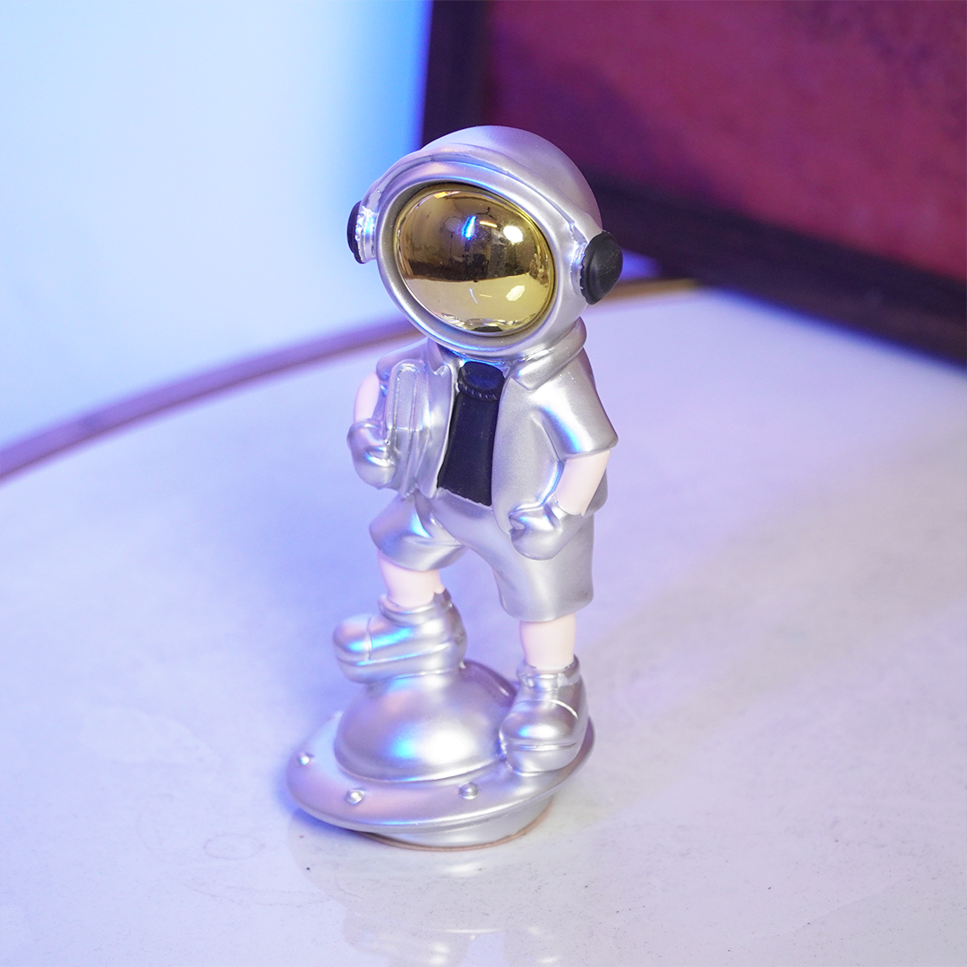 SpaceVibe™ Silver Astronaut Figurine – Metallic Resin Showpiece