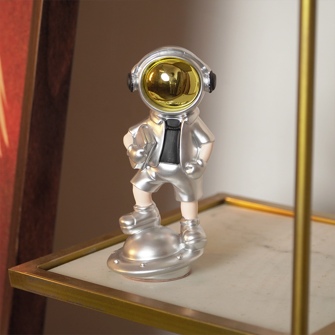 SpaceVibe™ Silver Astronaut Figurine – Metallic Resin Showpiece