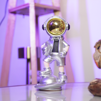 SpaceVibe™ Silver Astronaut Figurine – Metallic Resin Showpiece