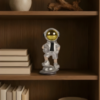 SpaceVibe™ Silver Astronaut Figurine – Metallic Resin Showpiece